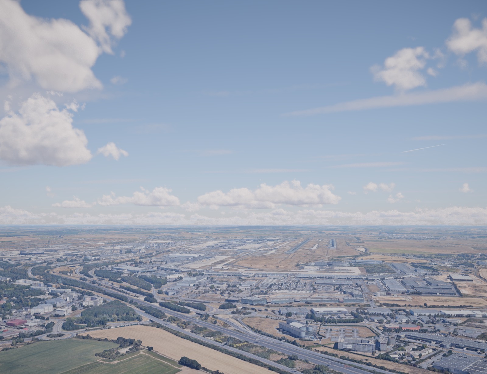 A city and its airport from cruise altitude, midday
