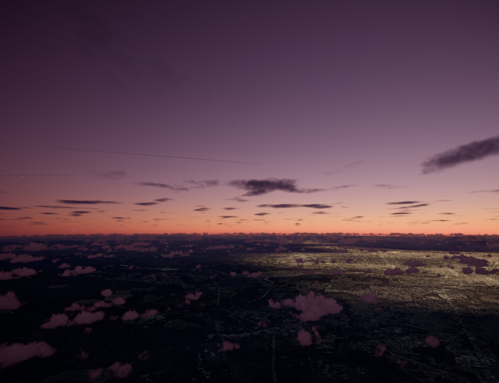 City lights coming on under a violet sky