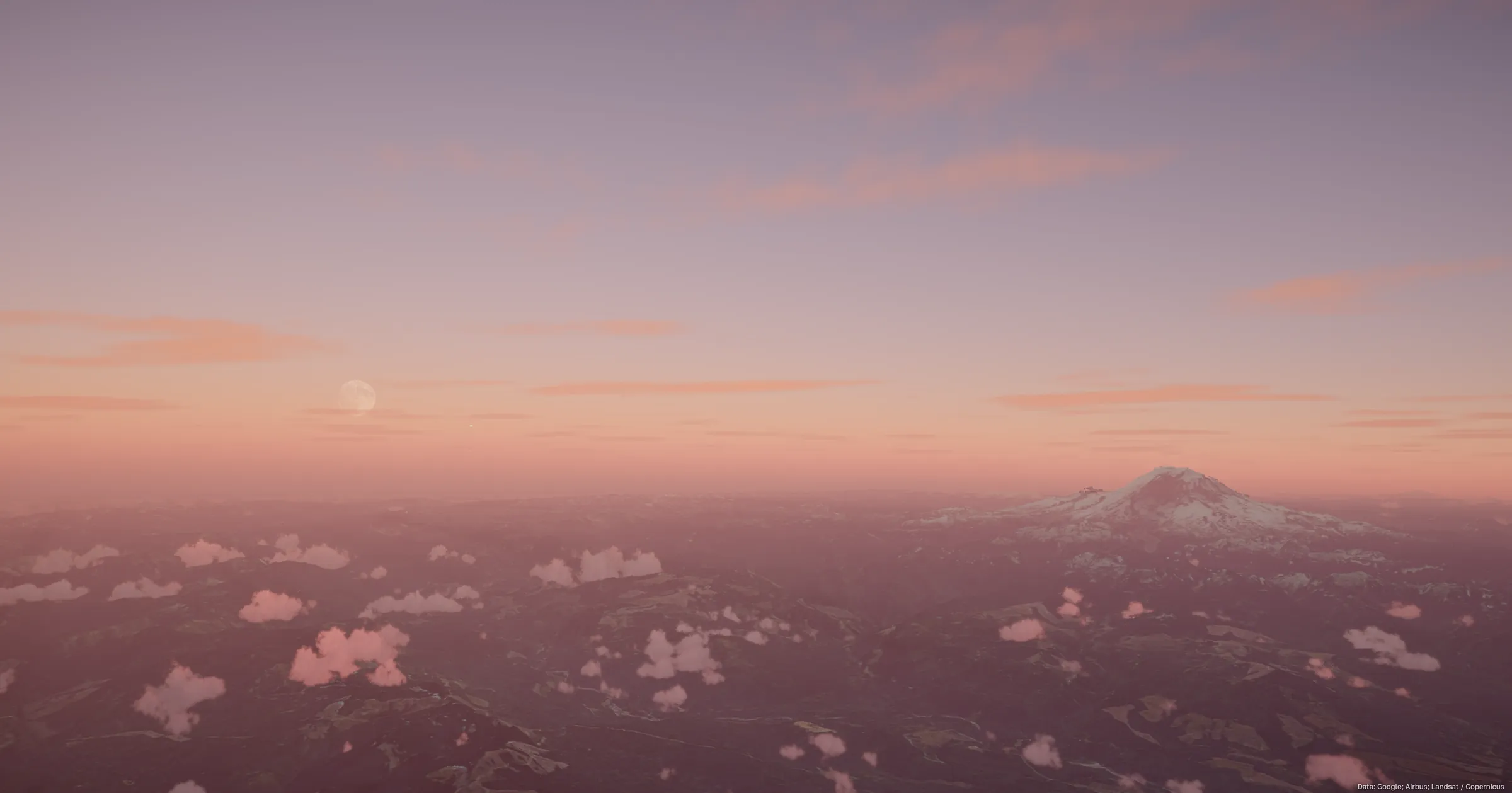 Mount Rainier on a pink dawn horizon with a pale moon low in the sky and scattered cloud over dark terrain