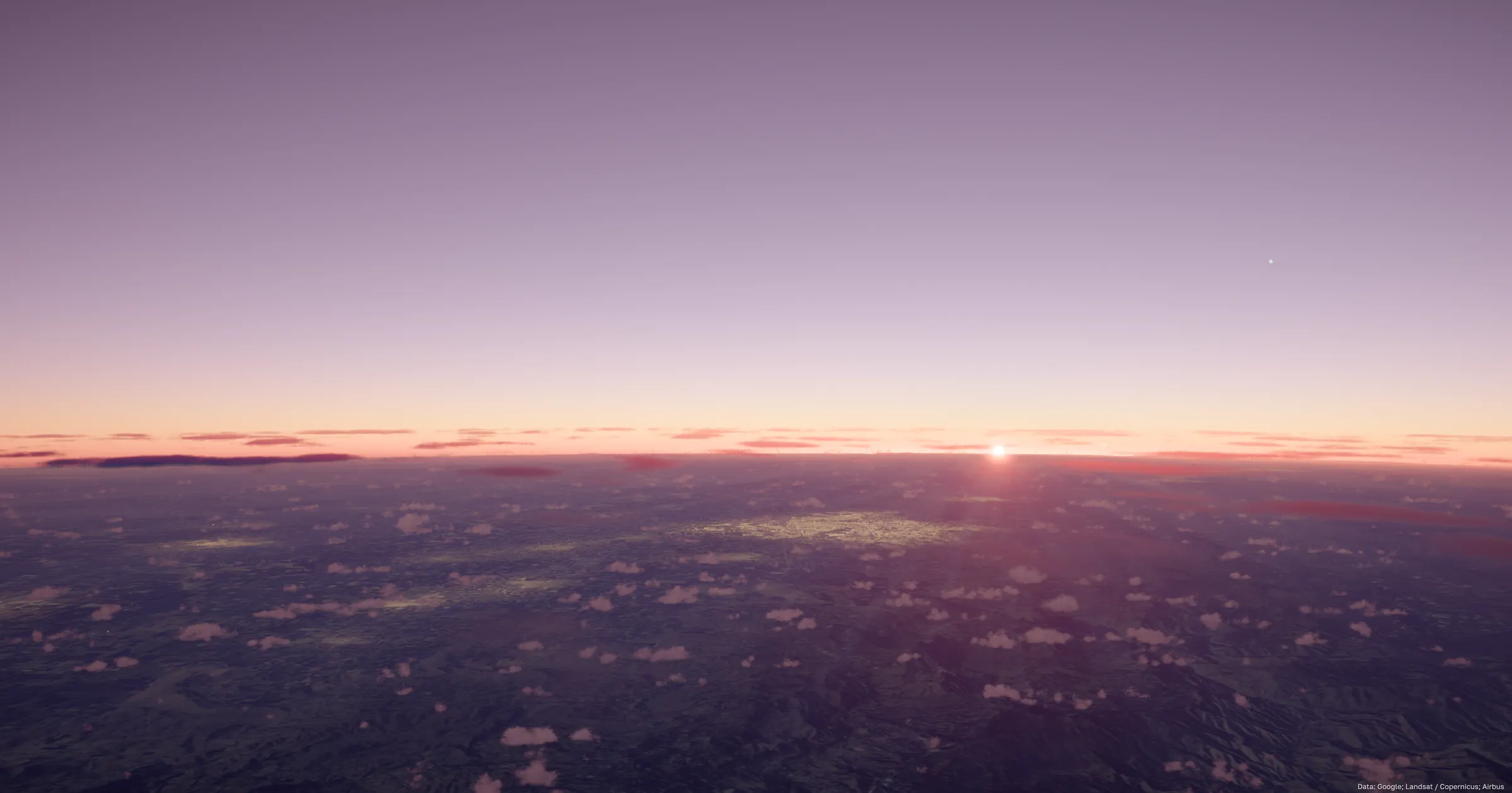 The sun setting on the horizon at cruising altitude, a lilac sky above pink haze and city lights glinting through cloud
